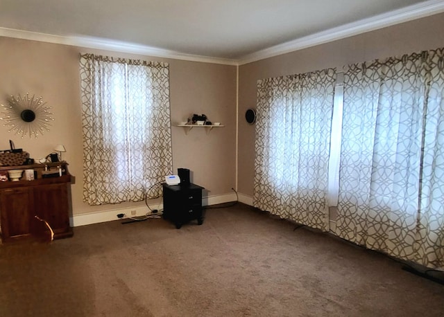 unfurnished room featuring ornamental molding and carpet flooring