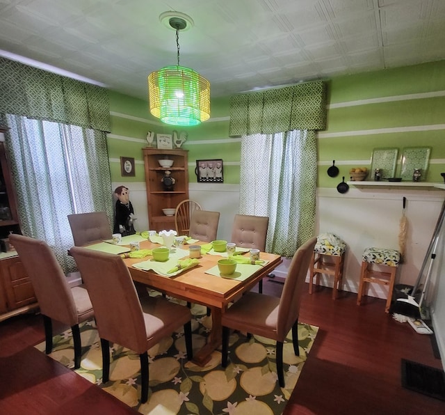 dining space featuring hardwood / wood-style floors