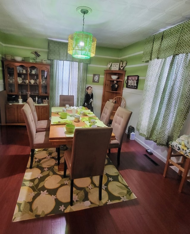 dining space featuring hardwood / wood-style flooring