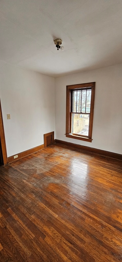 empty room featuring dark hardwood / wood-style floors