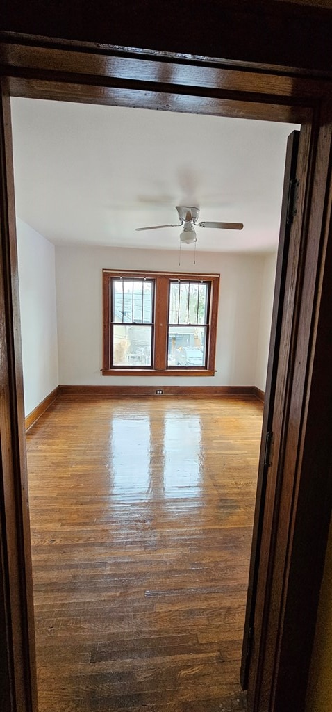 spare room with ceiling fan and light hardwood / wood-style floors