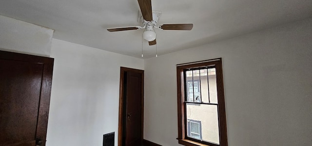 interior details featuring ceiling fan