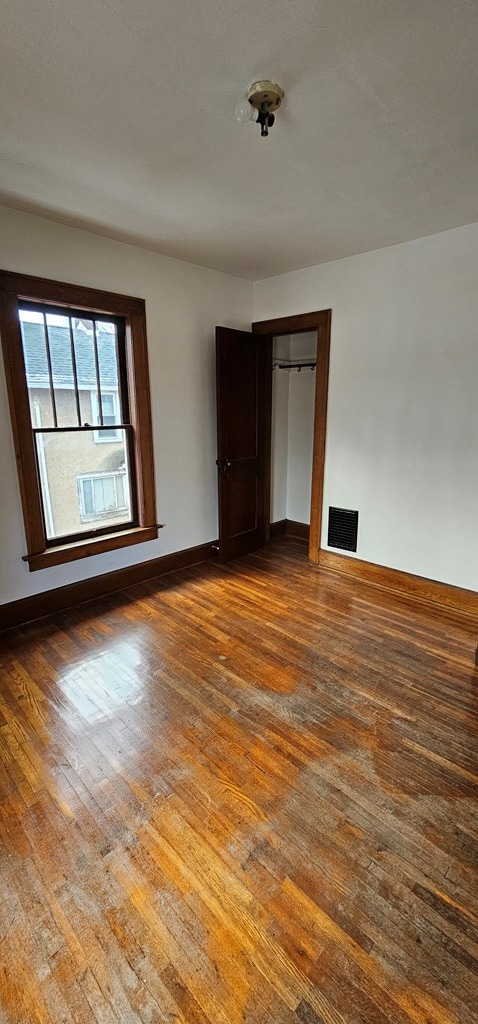 empty room featuring hardwood / wood-style flooring