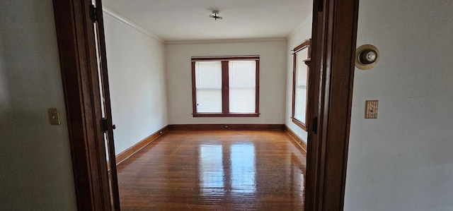 unfurnished room with crown molding and light hardwood / wood-style floors