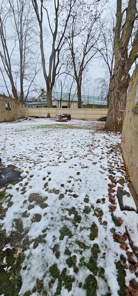 view of yard layered in snow