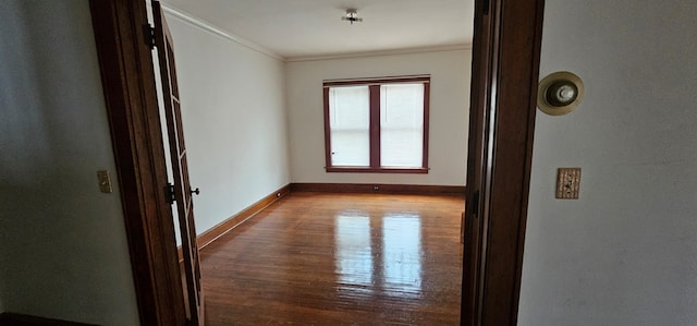 hallway featuring crown molding and light wood-type flooring