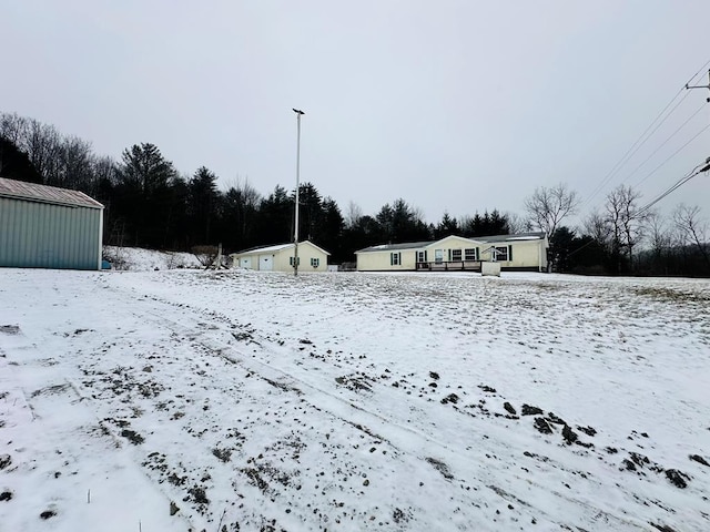 snowy yard with an outdoor structure