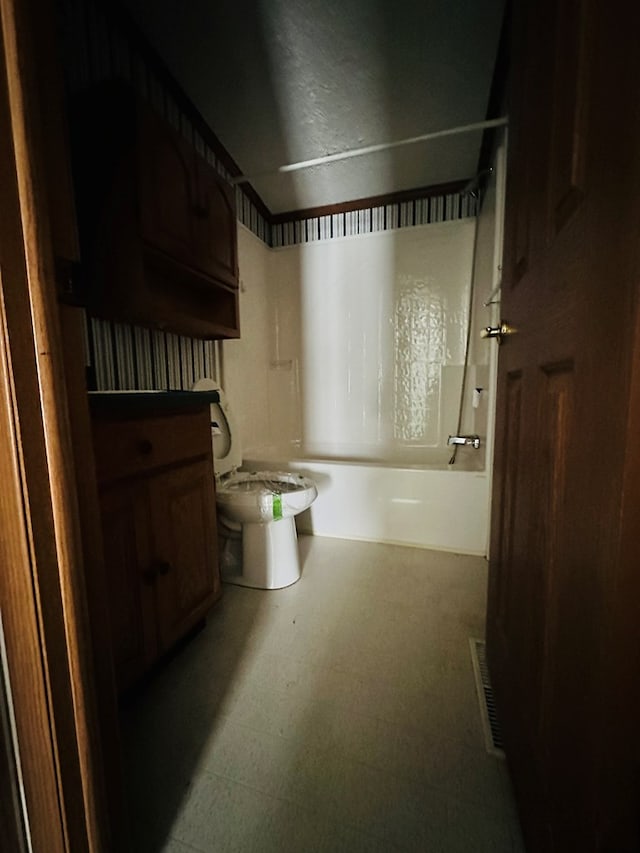 full bathroom featuring vanity, toilet, and shower / bathtub combination