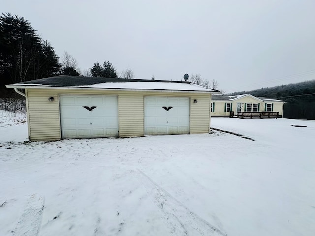 view of snow covered garage