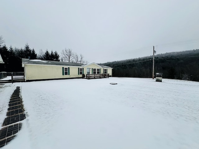 view of front of property featuring a wooden deck