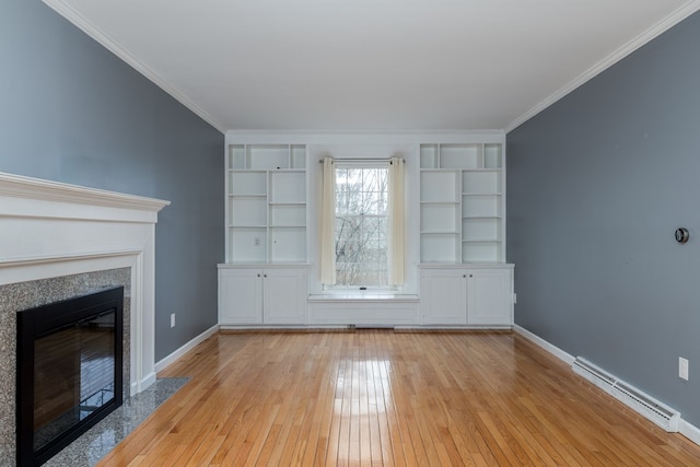 unfurnished living room with crown molding and light wood-type flooring