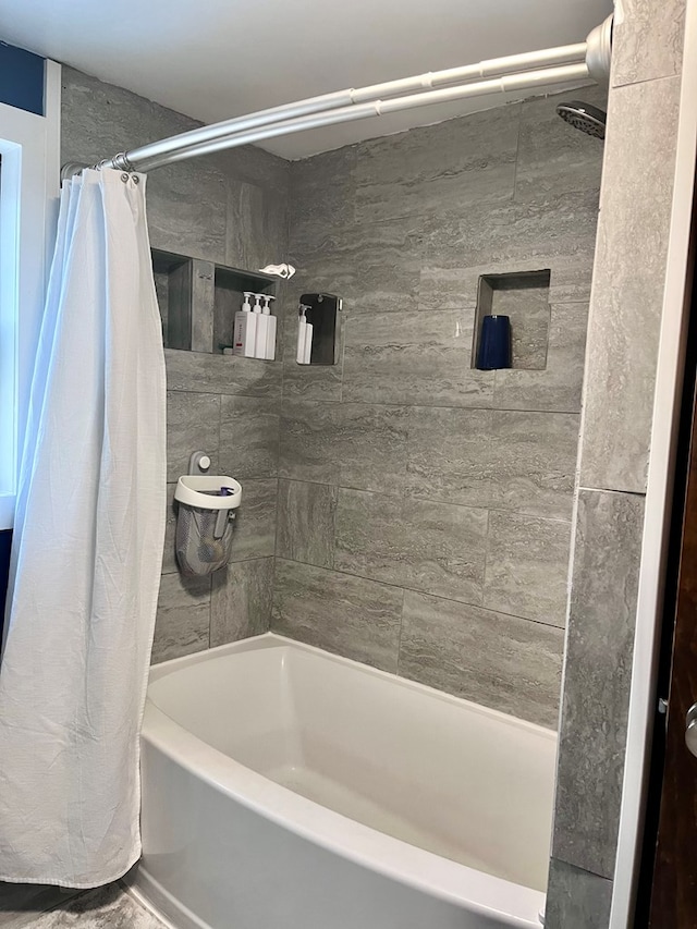 bathroom featuring shower / tub combo with curtain