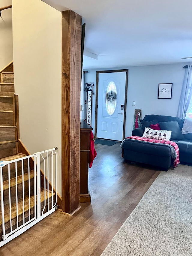 entryway with hardwood / wood-style floors