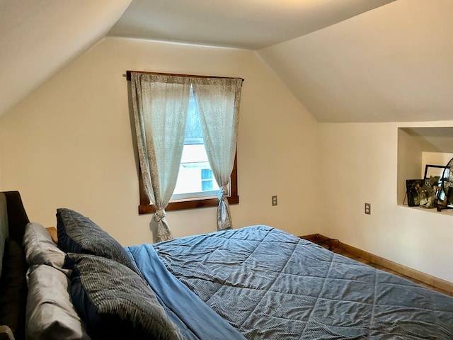 bedroom featuring vaulted ceiling