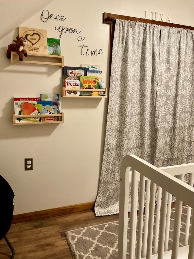 bedroom with hardwood / wood-style floors