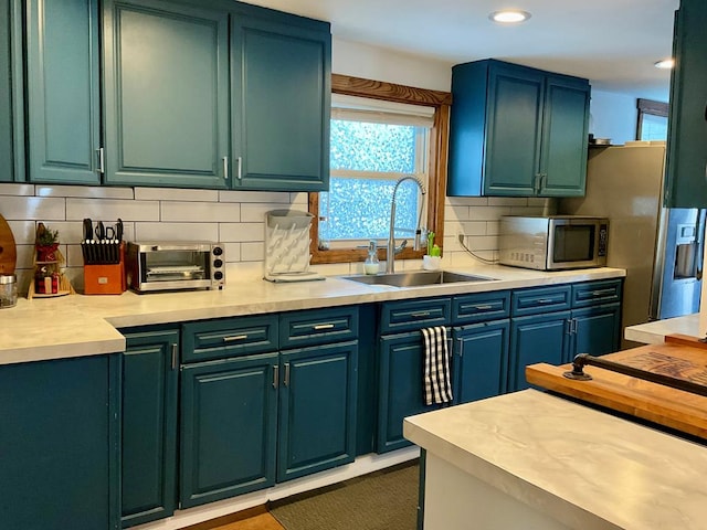 kitchen featuring sink and backsplash