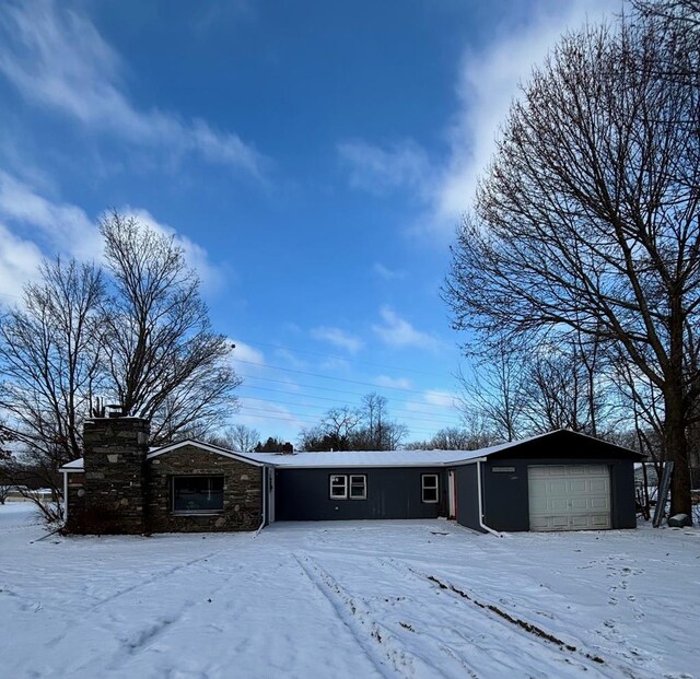 single story home with a garage