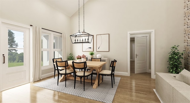 dining space with a chandelier, hardwood / wood-style flooring, and high vaulted ceiling