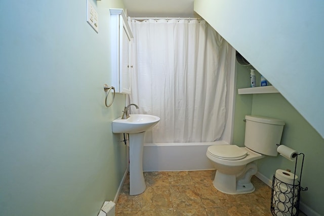 bathroom featuring toilet and shower / tub combo with curtain