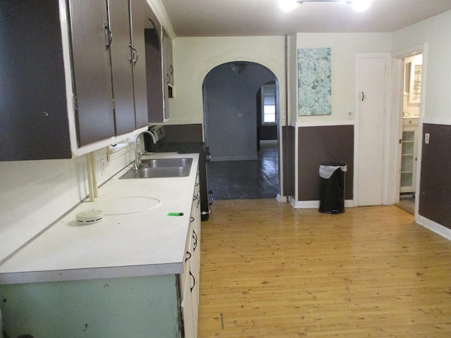 kitchen with light wood-type flooring and sink