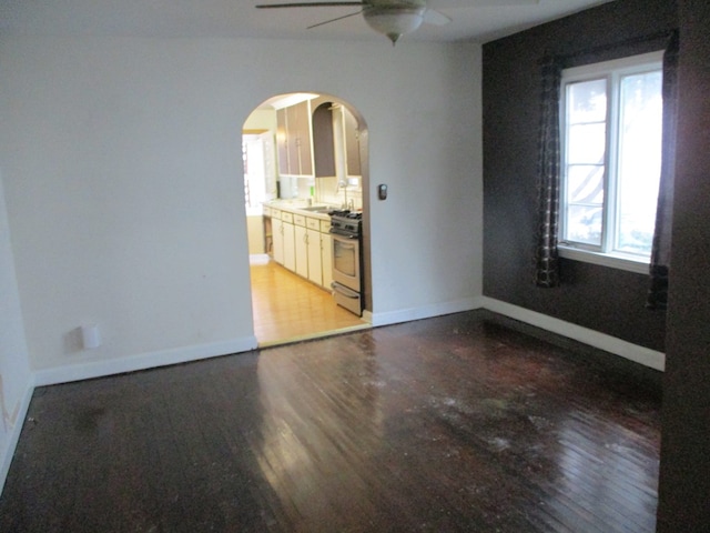 spare room with ceiling fan and light hardwood / wood-style floors