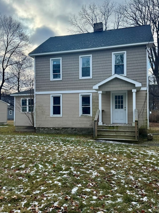 view of front of home with a lawn