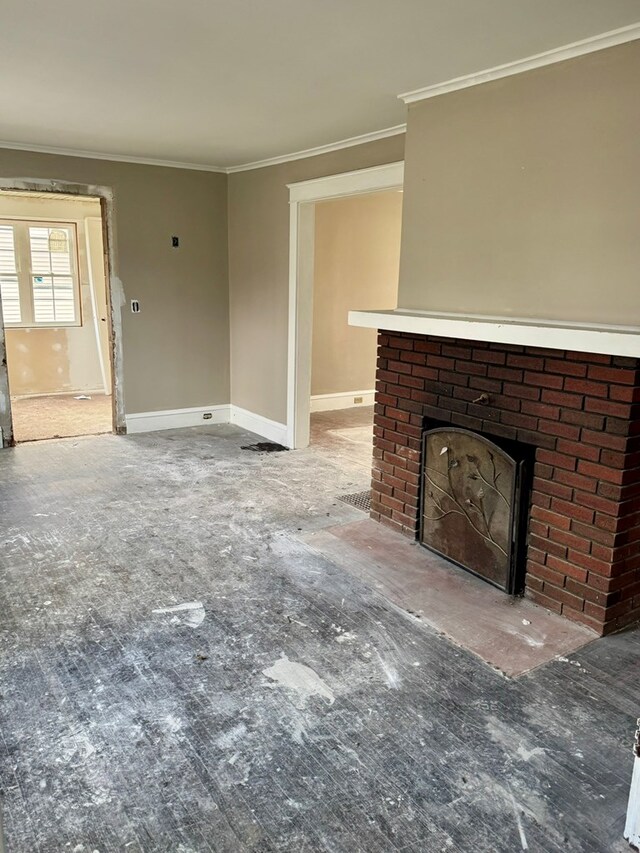 unfurnished living room featuring a fireplace and ornamental molding