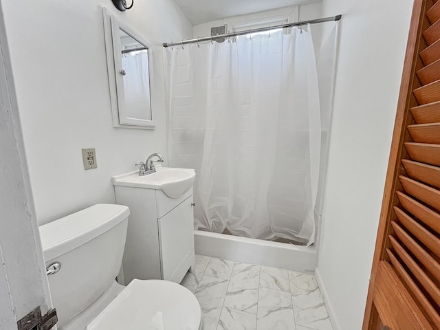 bathroom featuring toilet and vanity