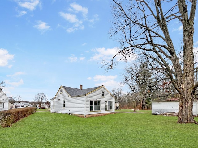 view of home's exterior with a yard