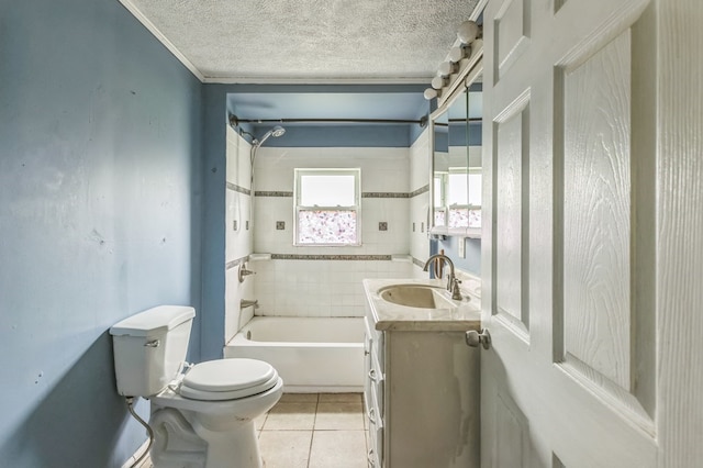 bathroom with toilet, a tub, tile patterned floors, a textured ceiling, and vanity