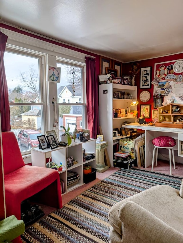 sitting room with carpet floors