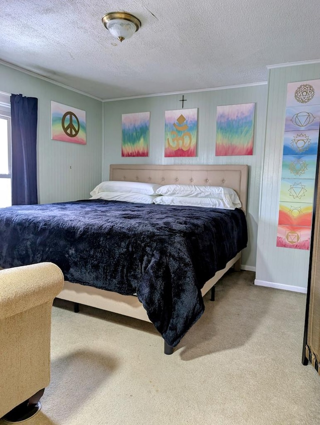 bedroom featuring carpet floors, a textured ceiling, and wooden walls