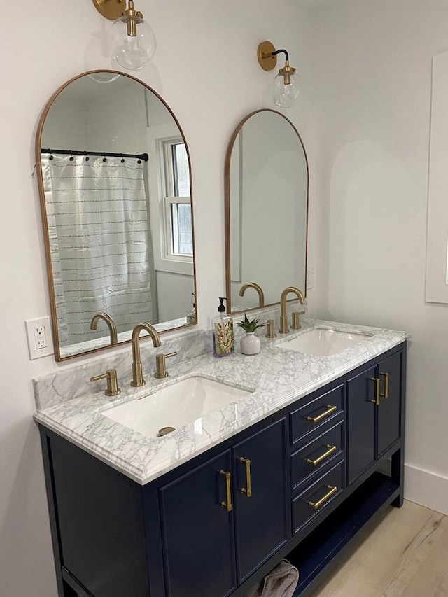 bathroom featuring hardwood / wood-style flooring and vanity