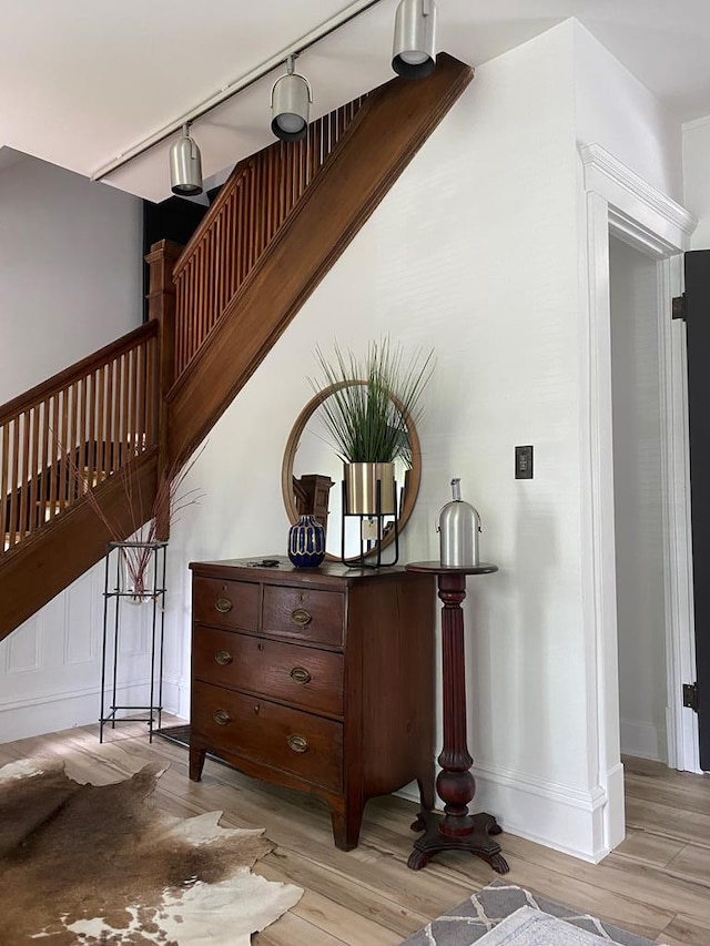 staircase with hardwood / wood-style flooring