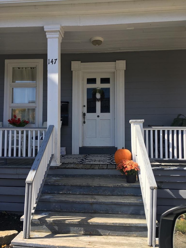 entrance to property with a porch