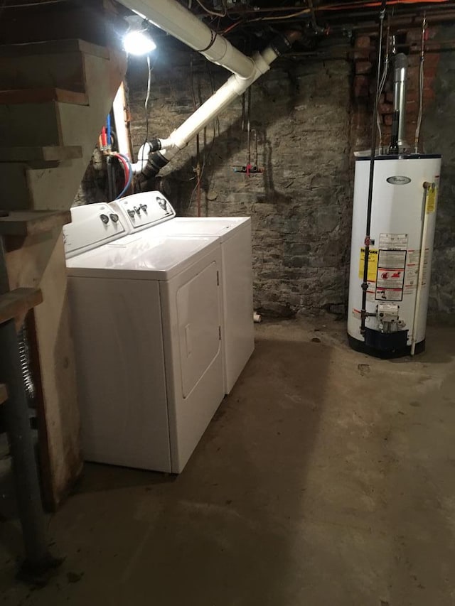 basement with separate washer and dryer and gas water heater