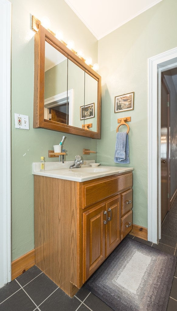 bathroom with tile patterned flooring and vanity