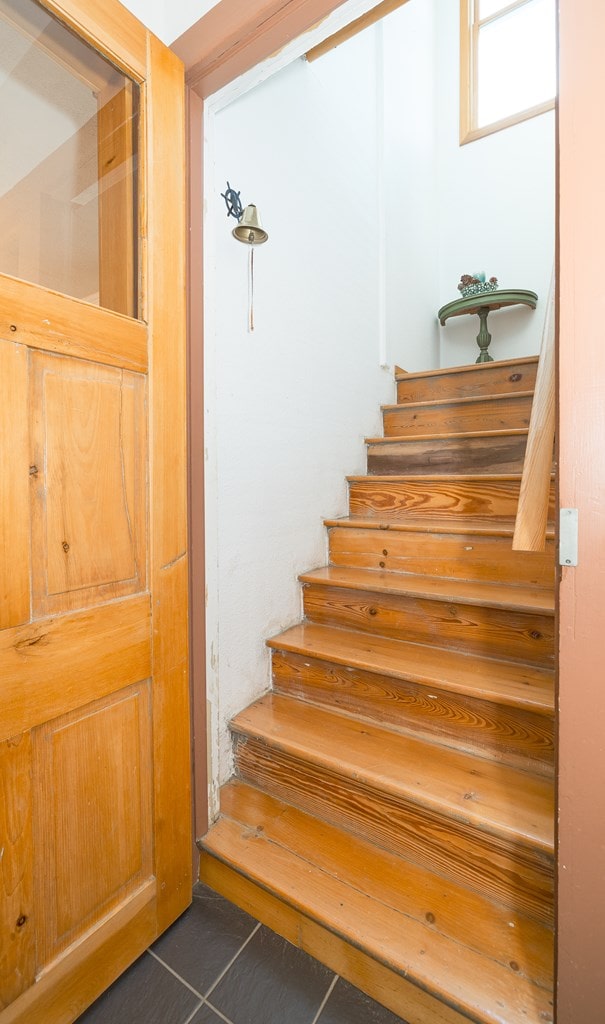 stairs with tile patterned floors