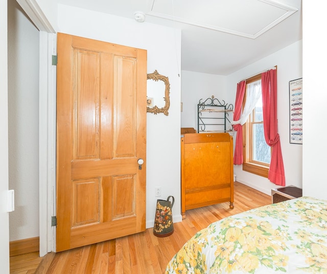 bedroom with hardwood / wood-style floors