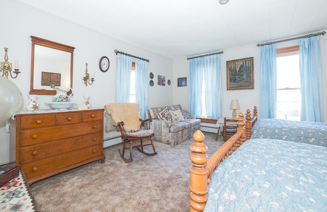 carpeted bedroom with a baseboard heating unit