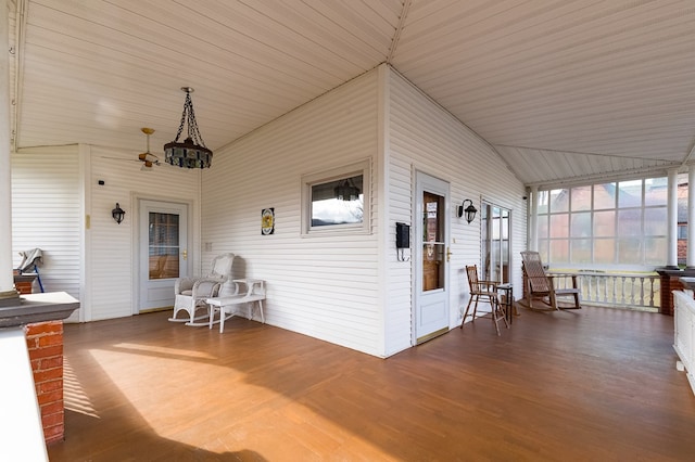 unfurnished sunroom with vaulted ceiling