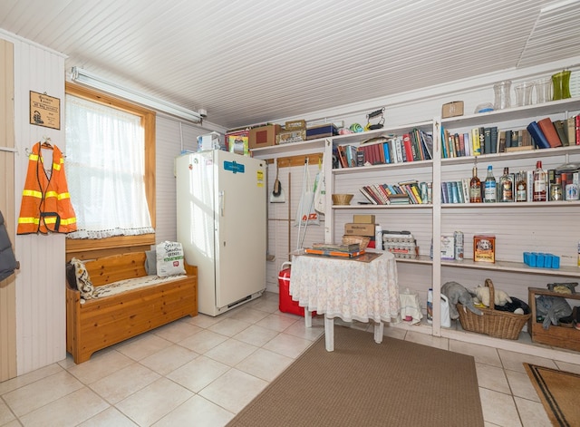 misc room with light tile patterned floors