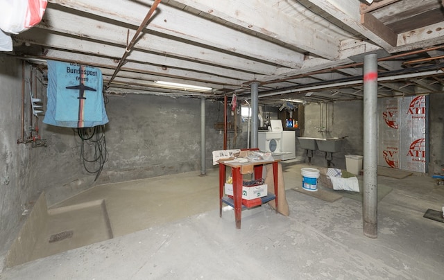 basement with washer / clothes dryer and sink