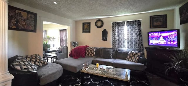 living room with a textured ceiling