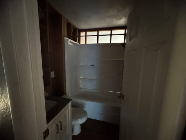 full bathroom with vanity, toilet, and washtub / shower combination