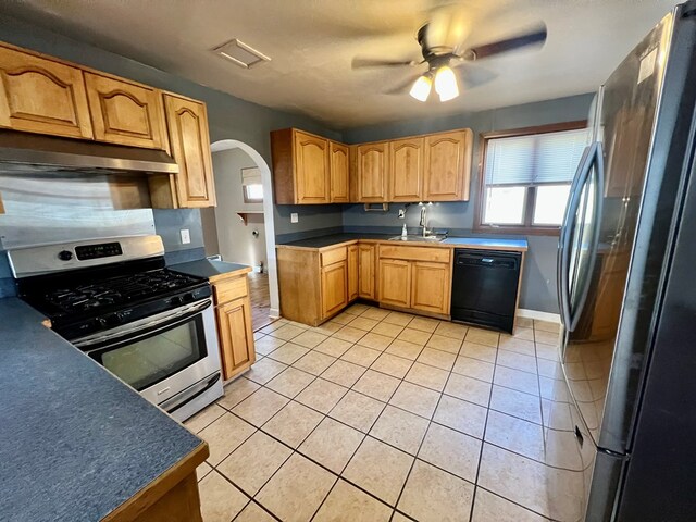 kitchen featuring ceiling fan, sink, light tile patterned floors, and appliances with stainless steel finishes