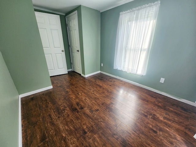 unfurnished bedroom featuring dark wood-type flooring