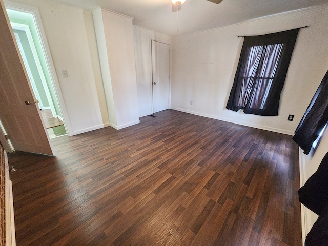 unfurnished bedroom featuring dark wood-type flooring