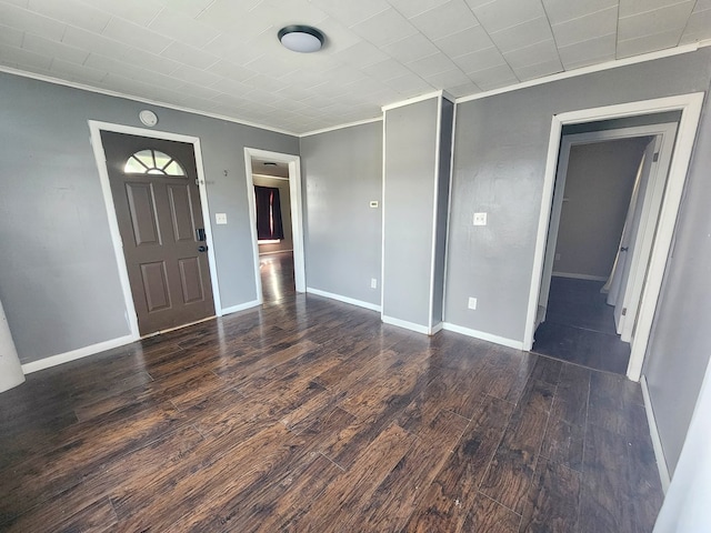 entrance foyer with crown molding and dark hardwood / wood-style flooring