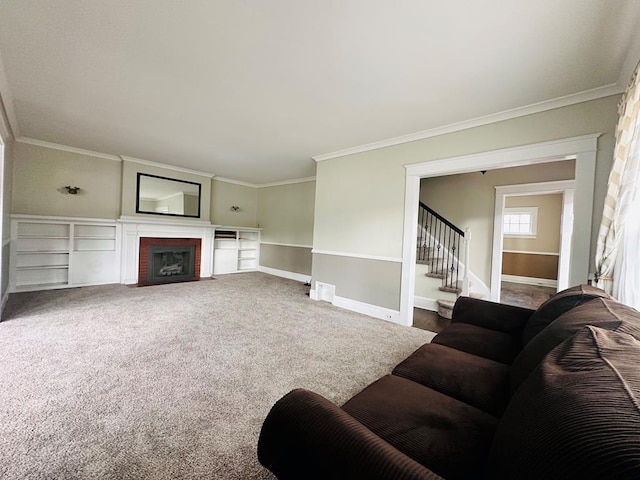 living room featuring ornamental molding, a brick fireplace, and carpet floors